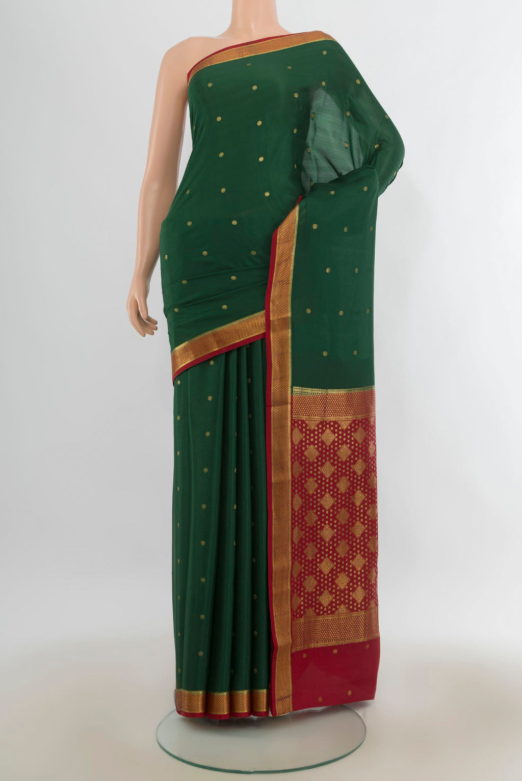 Green Mysore Crepe Saree with Zari Butta on the body and Zari Border.  displayed on a mannequin