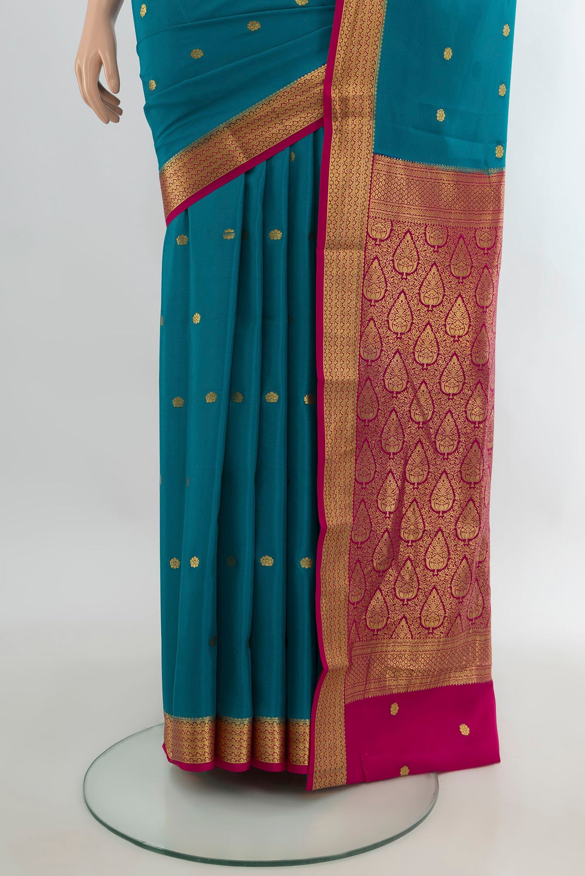 Pleats and pallu of Light Blue Mysore Crepe Saree with Zari Butta on the body and Zari Border. 