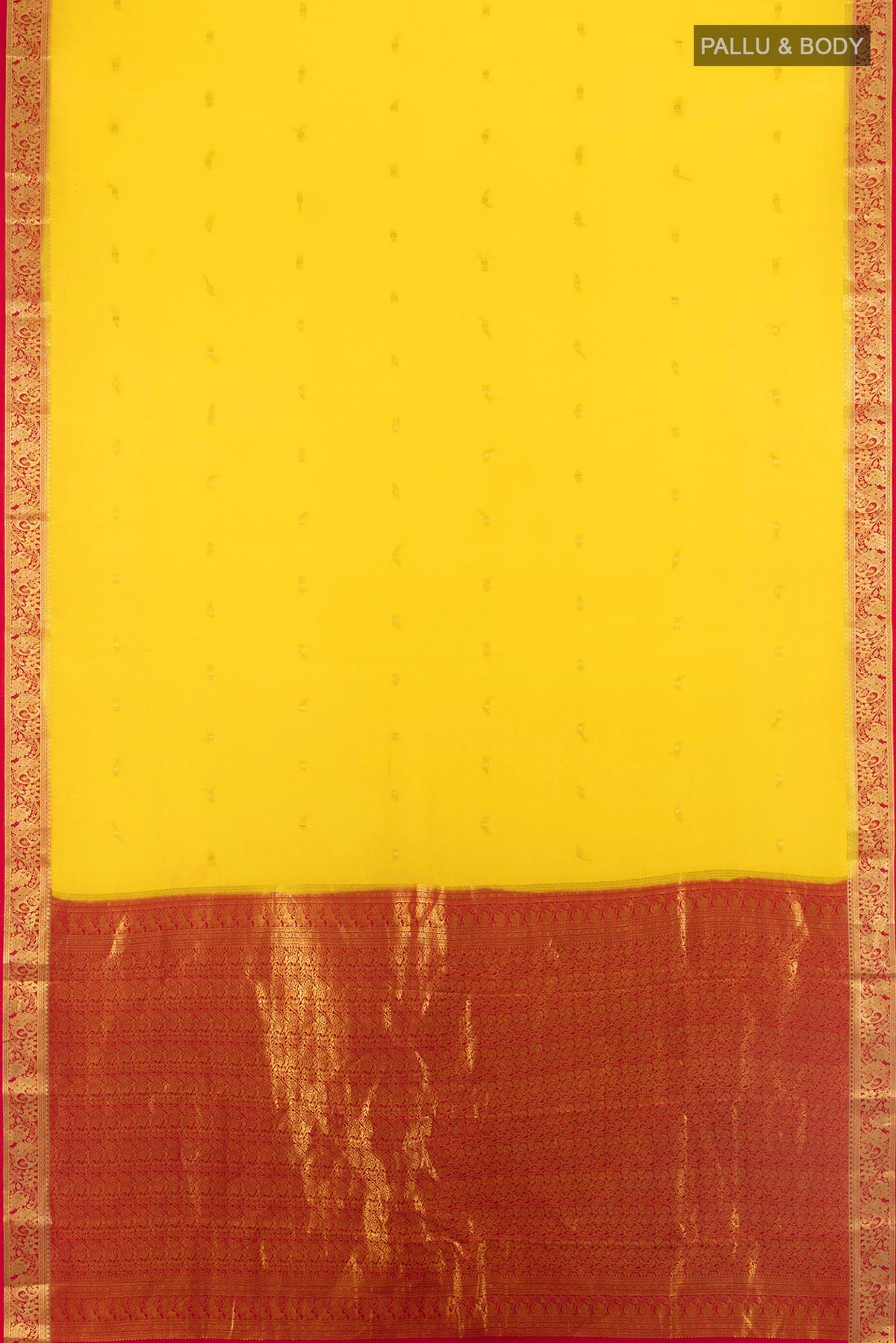 Flat view of Yellow Mysore Crepe Saree with Zari Butta on the body and Zari Border. 