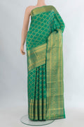 Pure Silk Turquoise Kanchipuram Saree with Zari Brocade on the body and Zari Border.  displayed on a mannequin