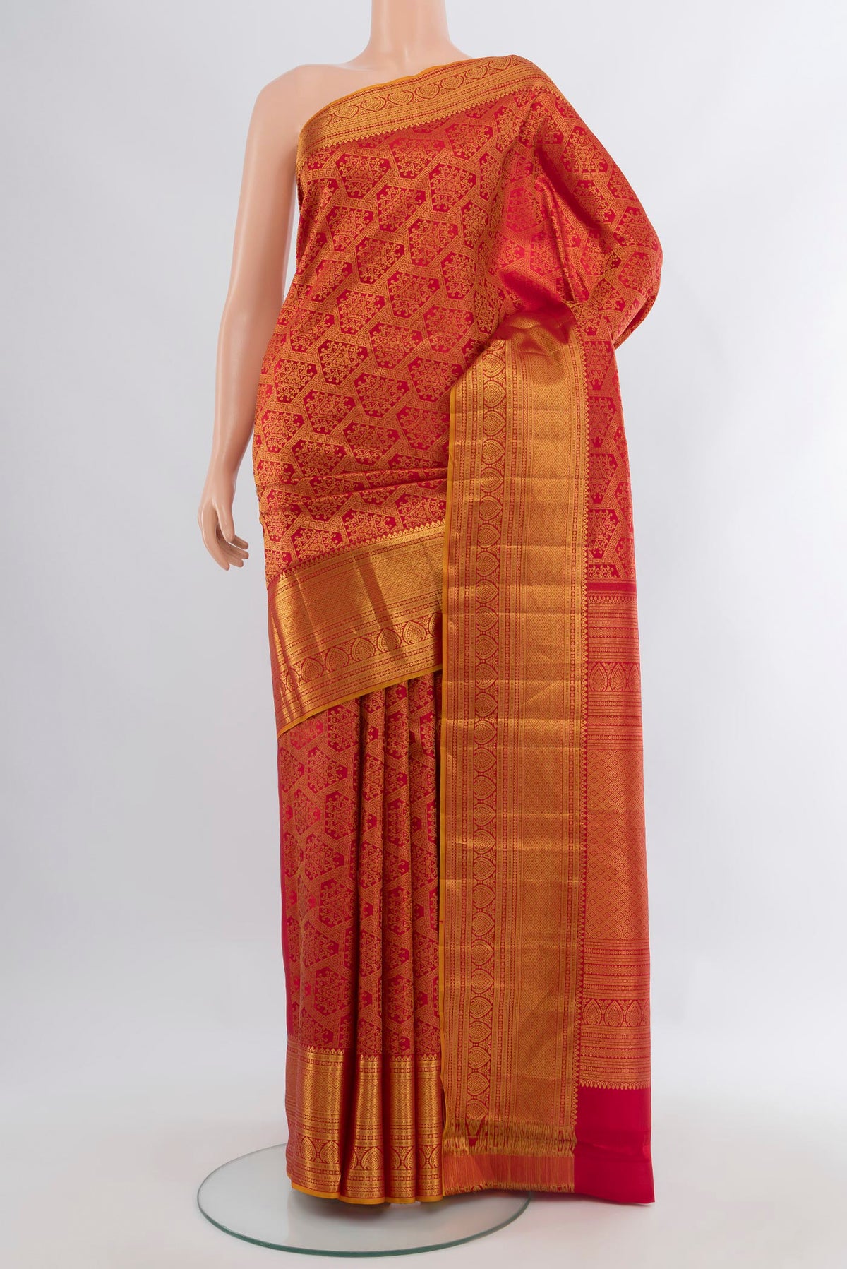 Red Kanchipuram Silk Saree with Zari Brocade on the body and Zari Border.  displayed on a mannequin