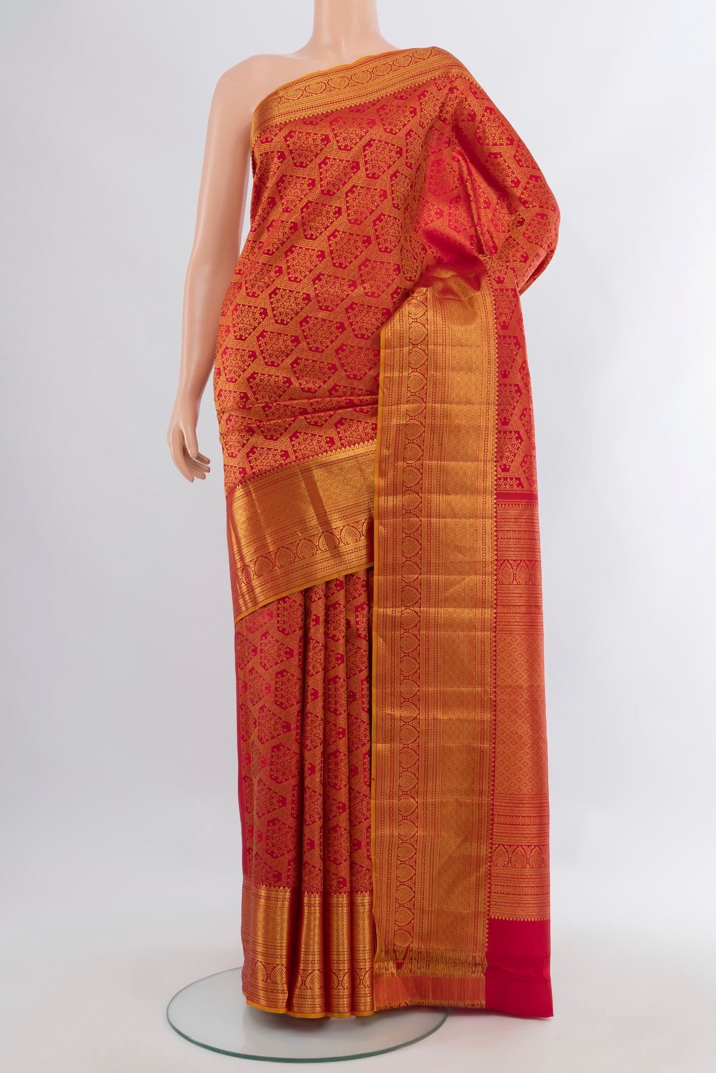 Red Kanchipuram Silk Saree with Zari Brocade on the body and Zari Border.  displayed on a mannequin