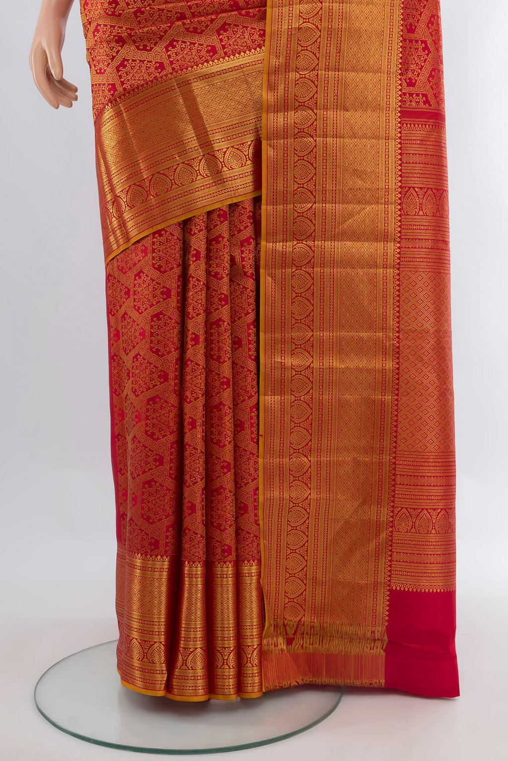 Pleats and pallu of Red Kanchipuram Silk Saree with Zari Brocade on the body and Zari Border. 