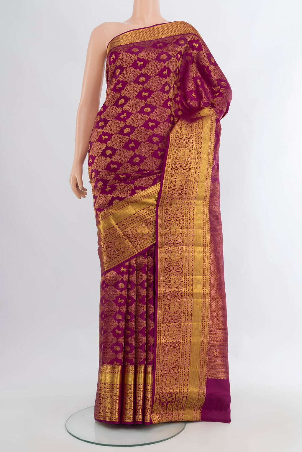 Magenta Kanchipuram Silk Saree with Zari Brocade on the body and Zari Border.  displayed on a mannequin
