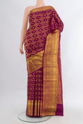 Magenta Kanchipuram Silk Saree with Zari Brocade on the body and Zari Border.  displayed on a mannequin