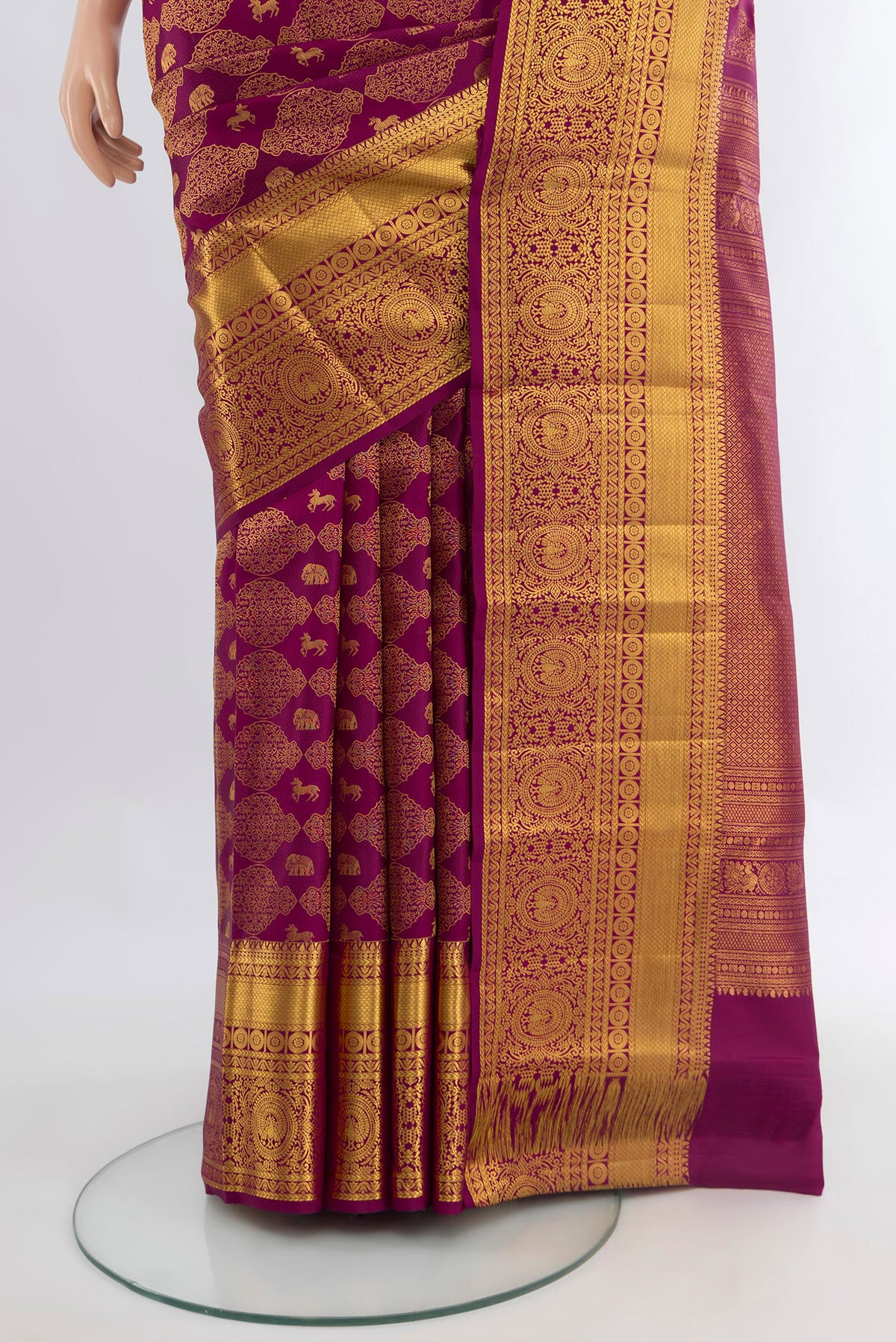 Pleats and pallu of Magenta Kanchipuram Silk Saree with Zari Brocade on the body and Zari Border. 