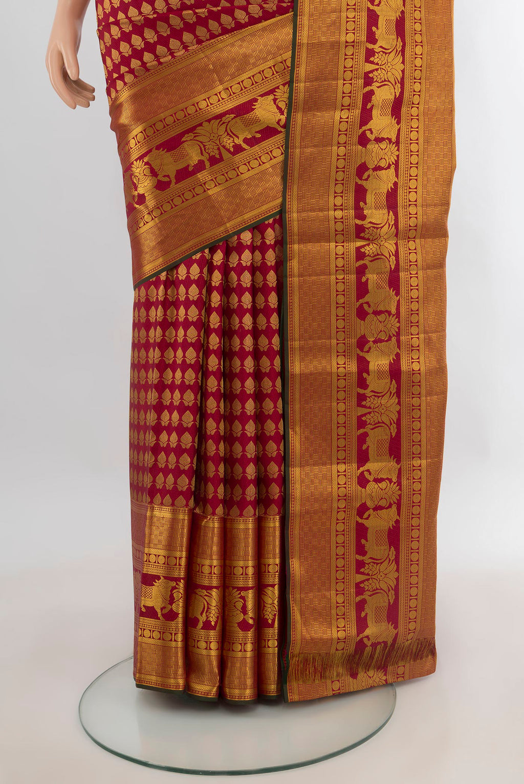 Pleats and pallu of Pure Silk Maroon Kanchipuram Saree with Zari Butta on the body and Zari Border. 