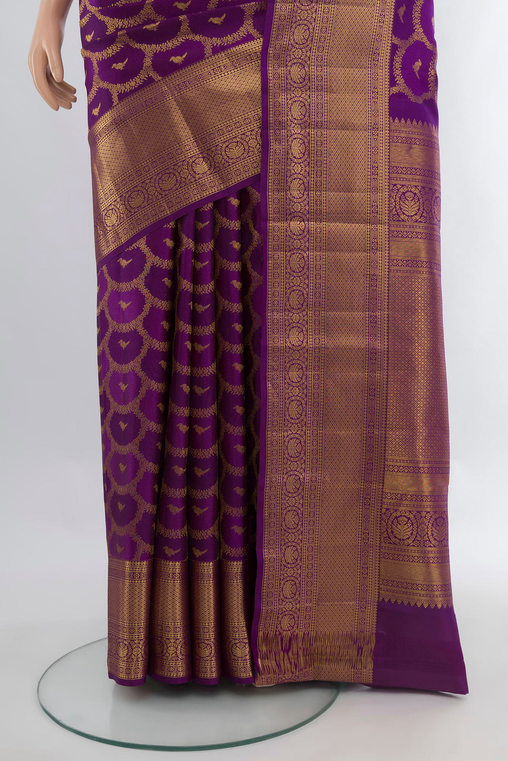 Pleats and pallu of Purple Kanchipuram Silk Saree with Zari Butta on the body and Zari Border. 