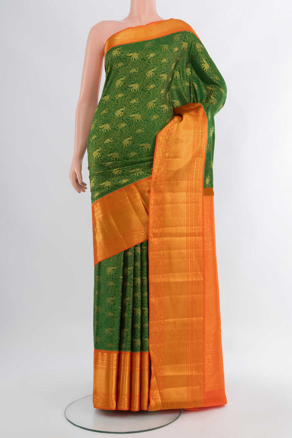 Green Kanjivaram Silk Saree with Zari Brocade on the body and Zari Border.  displayed on a mannequin