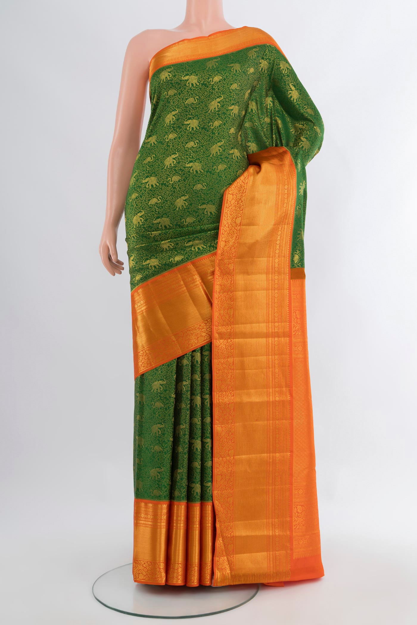 Green Kanjivaram Silk Saree with Zari Brocade on the body and Zari Border.  displayed on a mannequin