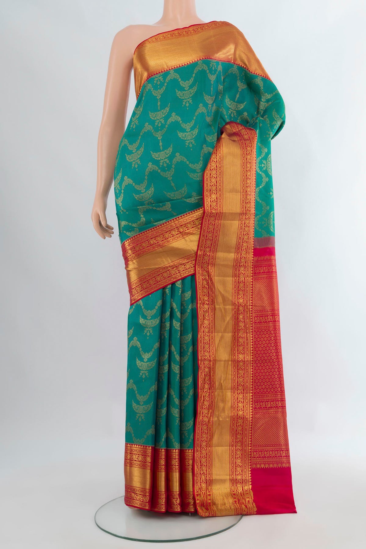 Pure Silk Peacock Blue Kanjivaram Saree with Zari Brocade on the body and Zari Border.  displayed on a mannequin