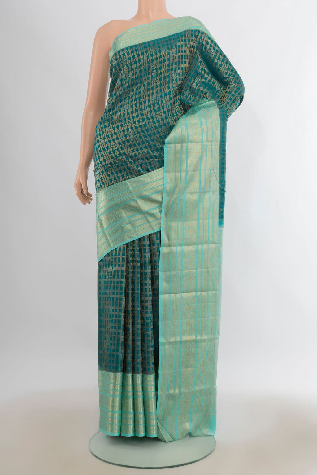 Pure Silk Peacock Blue Kanjivaram Saree with Checked design on the body and Zari Border.  displayed on a mannequin