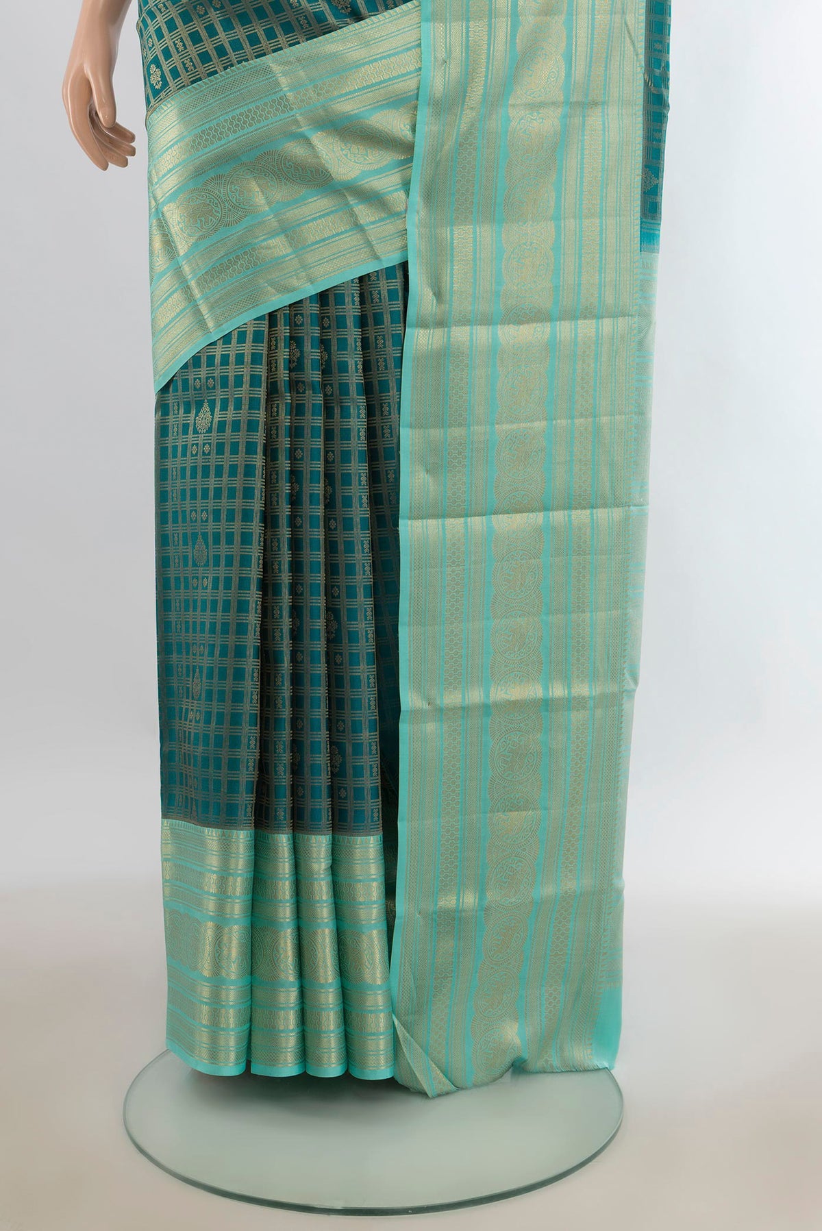 Pleats and pallu of Pure Silk Peacock Blue Kanjivaram Saree with Checked design on the body and Zari Border. 