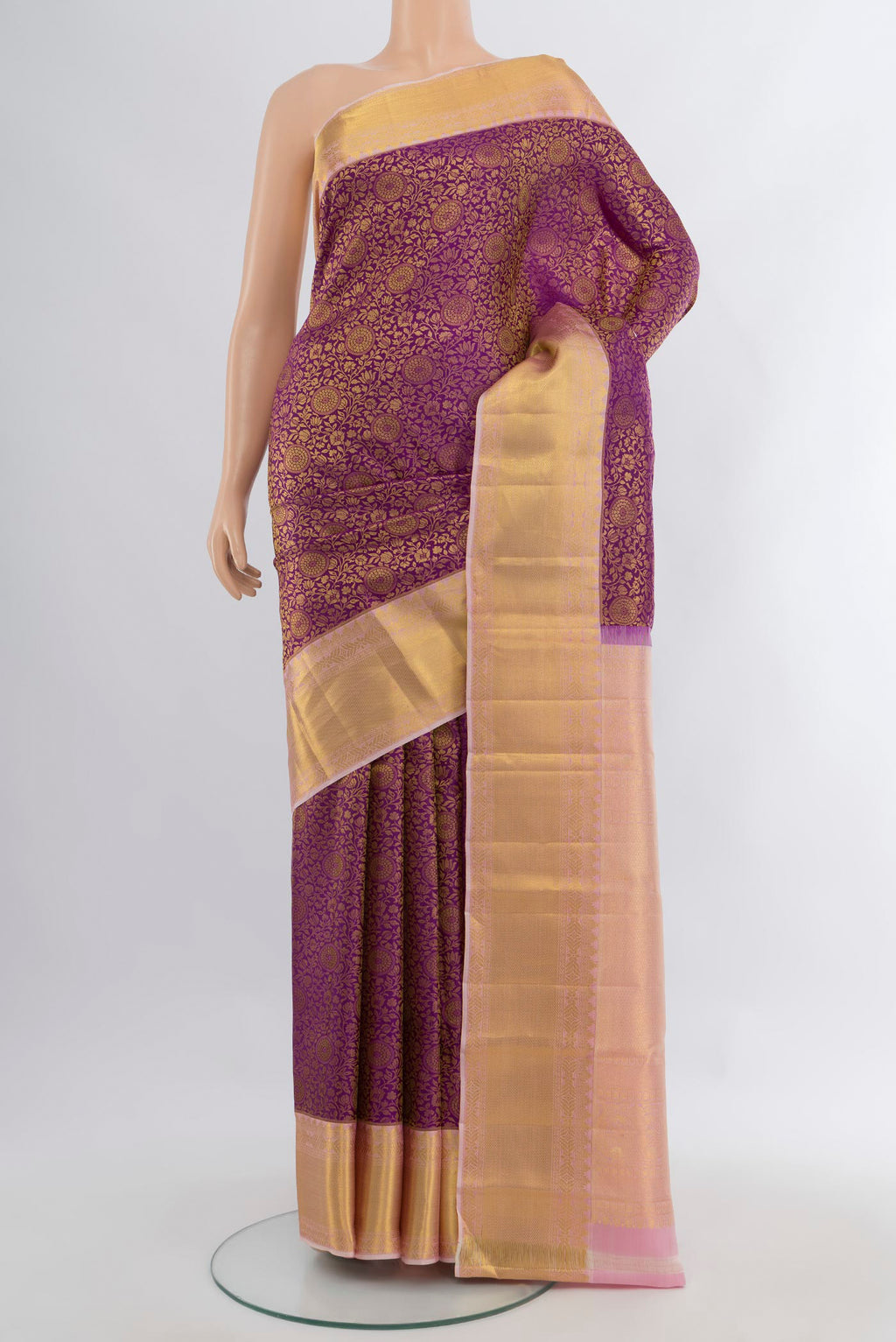 Purple Kanjivaram Silk Saree with Zari Brocade on the body and Zari Border.  displayed on a mannequin