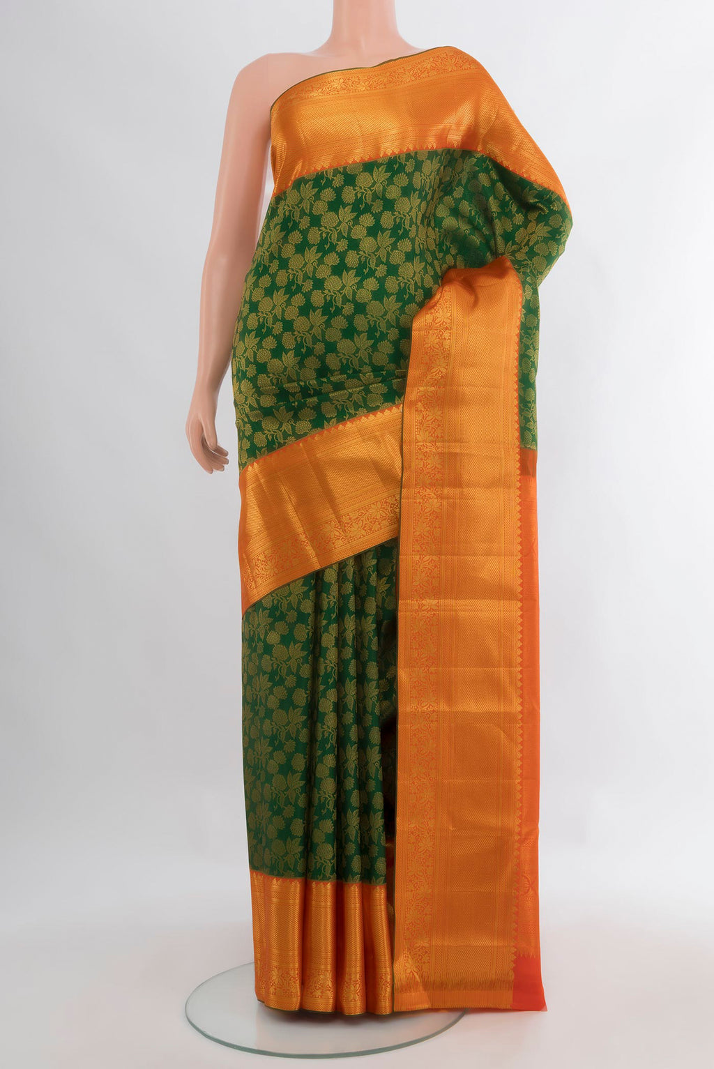 Pure Silk Green Kanjivaram Saree with Zari Brocade on the body and Zari Border.  displayed on a mannequin