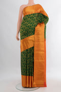 Pure Silk Green Kanjivaram Saree with Zari Brocade on the body and Zari Border.  displayed on a mannequin
