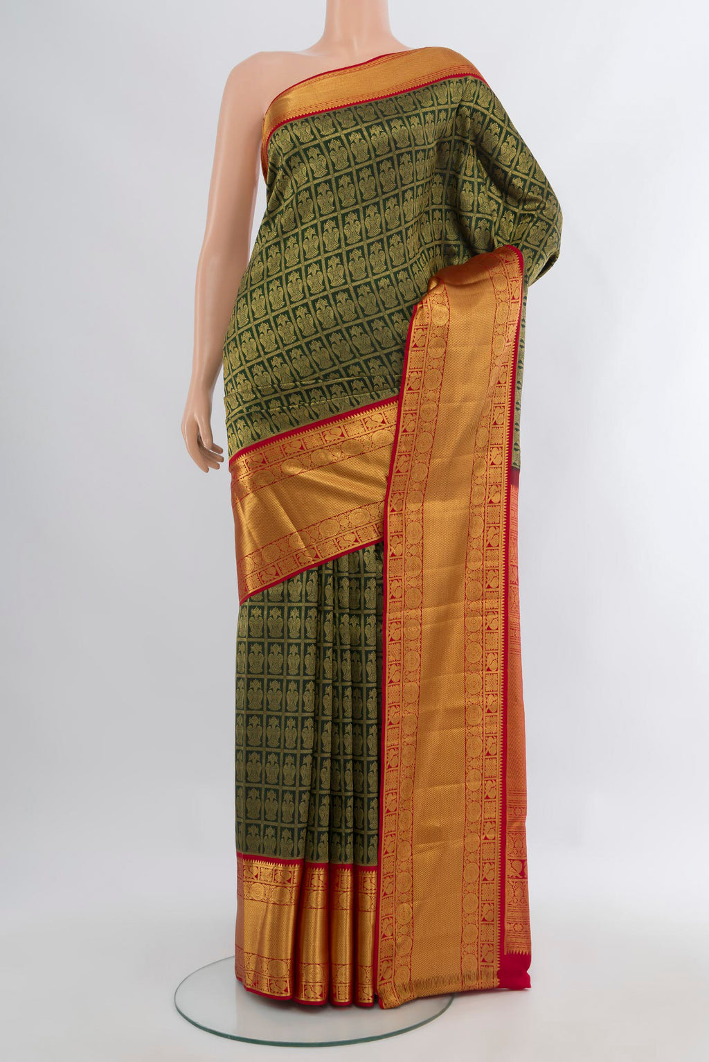 Bottle Green Kanjivaram Silk Saree with Zari Brocade on the body and Zari Border.  displayed on a mannequin