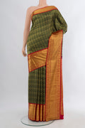 Bottle Green Kanjivaram Silk Saree with Zari Brocade on the body and Zari Border.  displayed on a mannequin