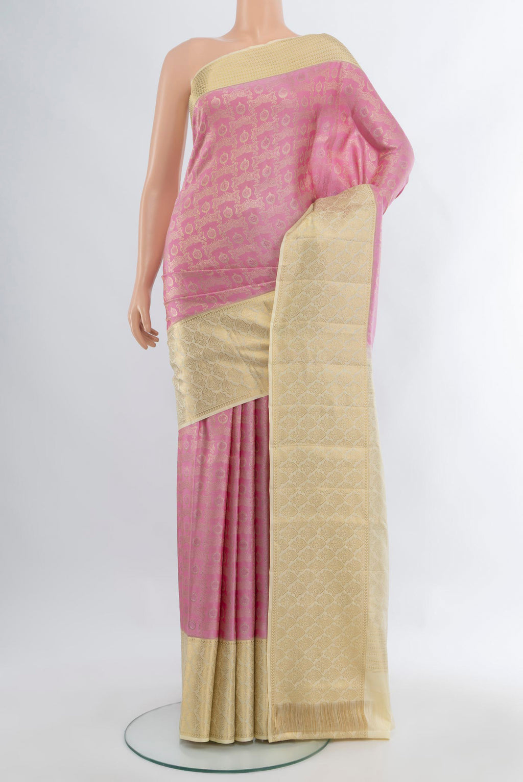 Rose pink Kanjivaram Silk Saree with Zari Brocade on the body and Zari Border.  displayed on a mannequin