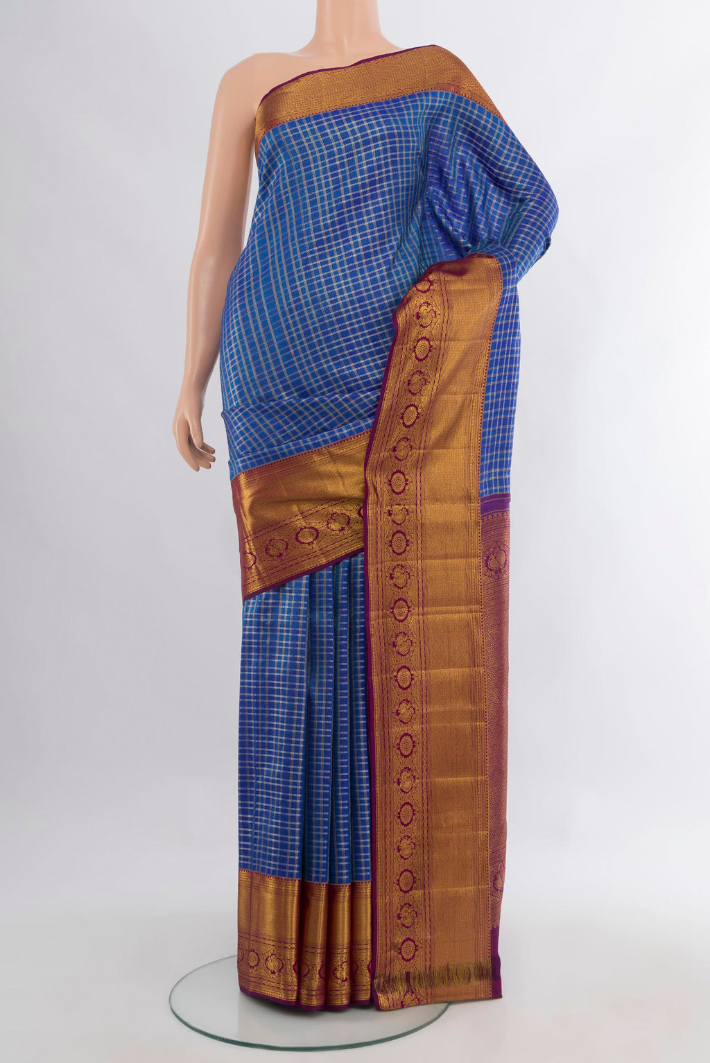 Pure Silk Royal Blue Kanjivaram Saree with Checked design on the body and Zari Border.  displayed on a mannequin