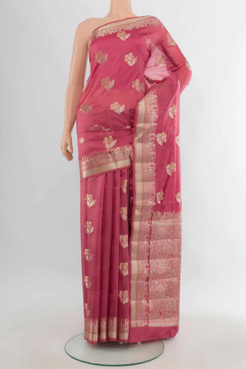 Pure Silk Coral Banarasi Raw Saree with Zari Butta on the body and Zari Border.  displayed on a mannequin