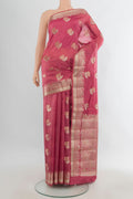 Pure Silk Coral Banarasi Raw Saree with Zari Butta on the body and Zari Border.  displayed on a mannequin