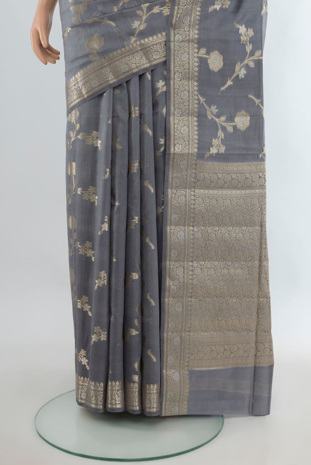 Pleats and pallu of Pure Silk Grey Banarasi Raw Saree with Zari Butta on the body and Zari Border. 