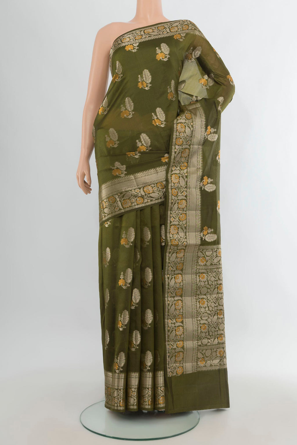 Pure Silk Green Banarasi Raw Saree with Zari Butta on the body and Zari Border.  displayed on a mannequin
