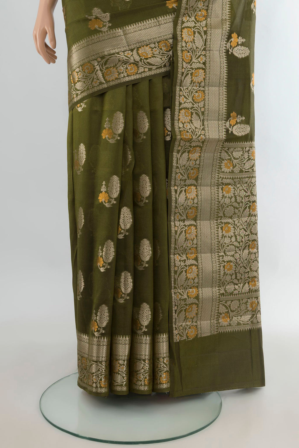 Pleats and pallu of Pure Silk Green Banarasi Raw Saree with Zari Butta on the body and Zari Border. 