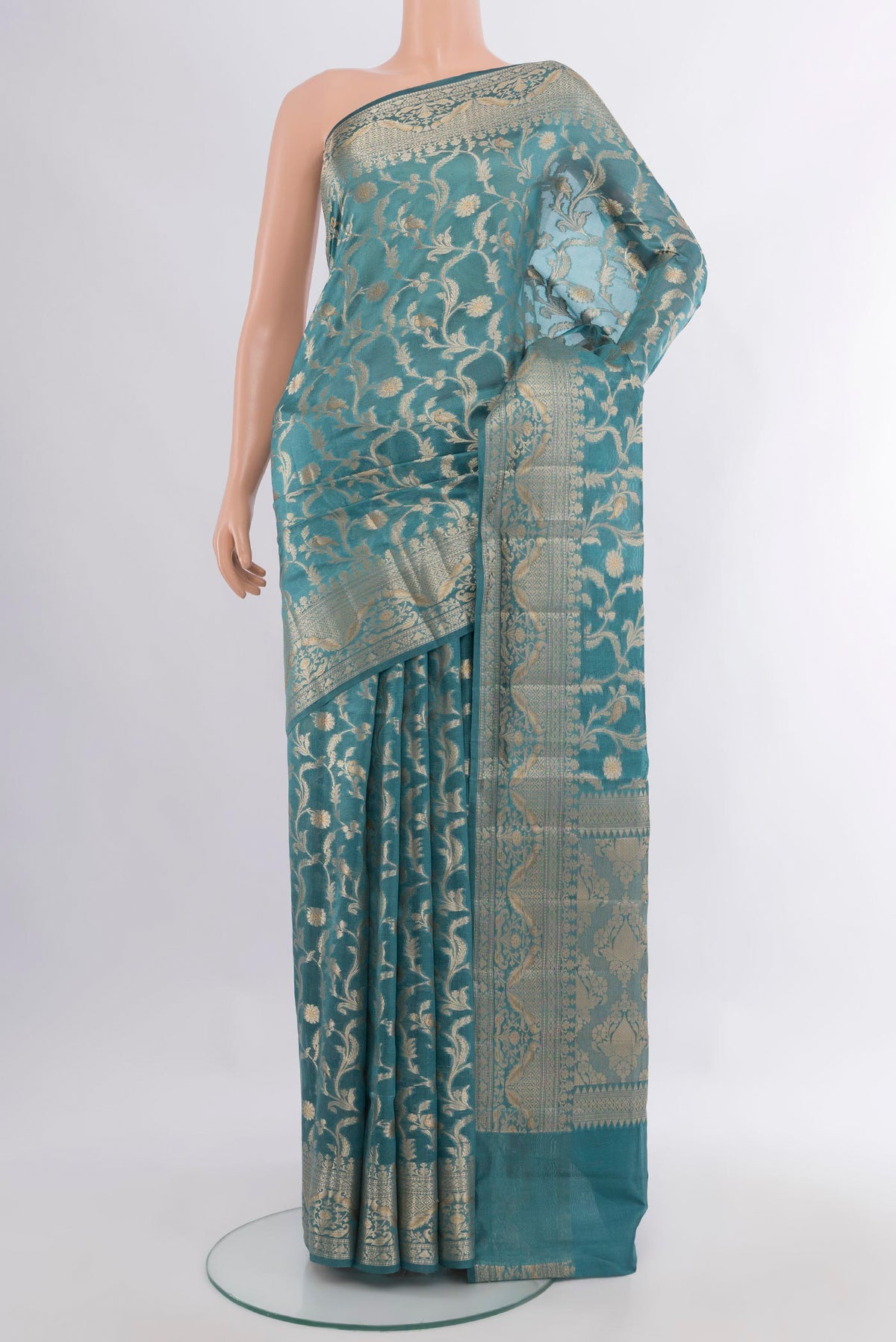 Pure Silk Light Blue Banarasi Raw Saree with Zari Brocade on the body and Zari Border.  displayed on a mannequin