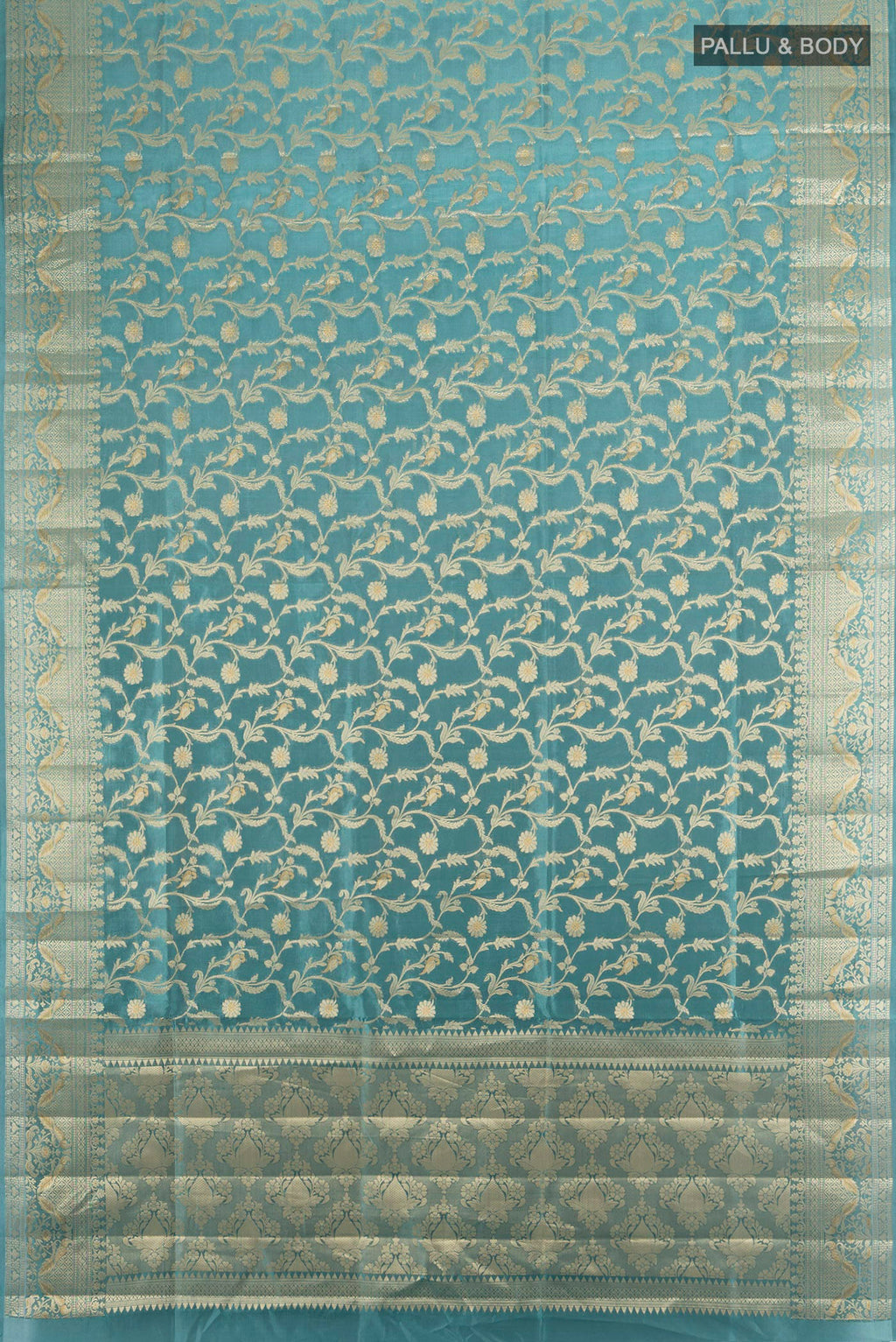 Flat view of Pure Silk Light Blue Banarasi Raw Saree with Zari Brocade on the body and Zari Border. 