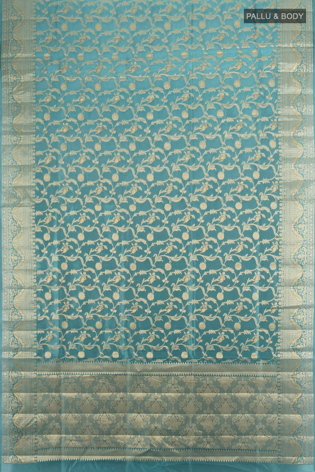 Flat view of Pure Silk Light Blue Banarasi Raw Saree with Zari Brocade on the body and Zari Border. 