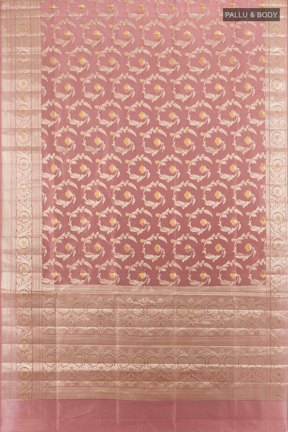 Flat view of Pure Silk Rose Gold Banarasi Raw Saree with Zari Butta on the body and Zari Border. 