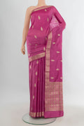 Pure Silk Pink Banarasi Raw Saree with Zari Butta on the body and Zari Border.  displayed on a mannequin