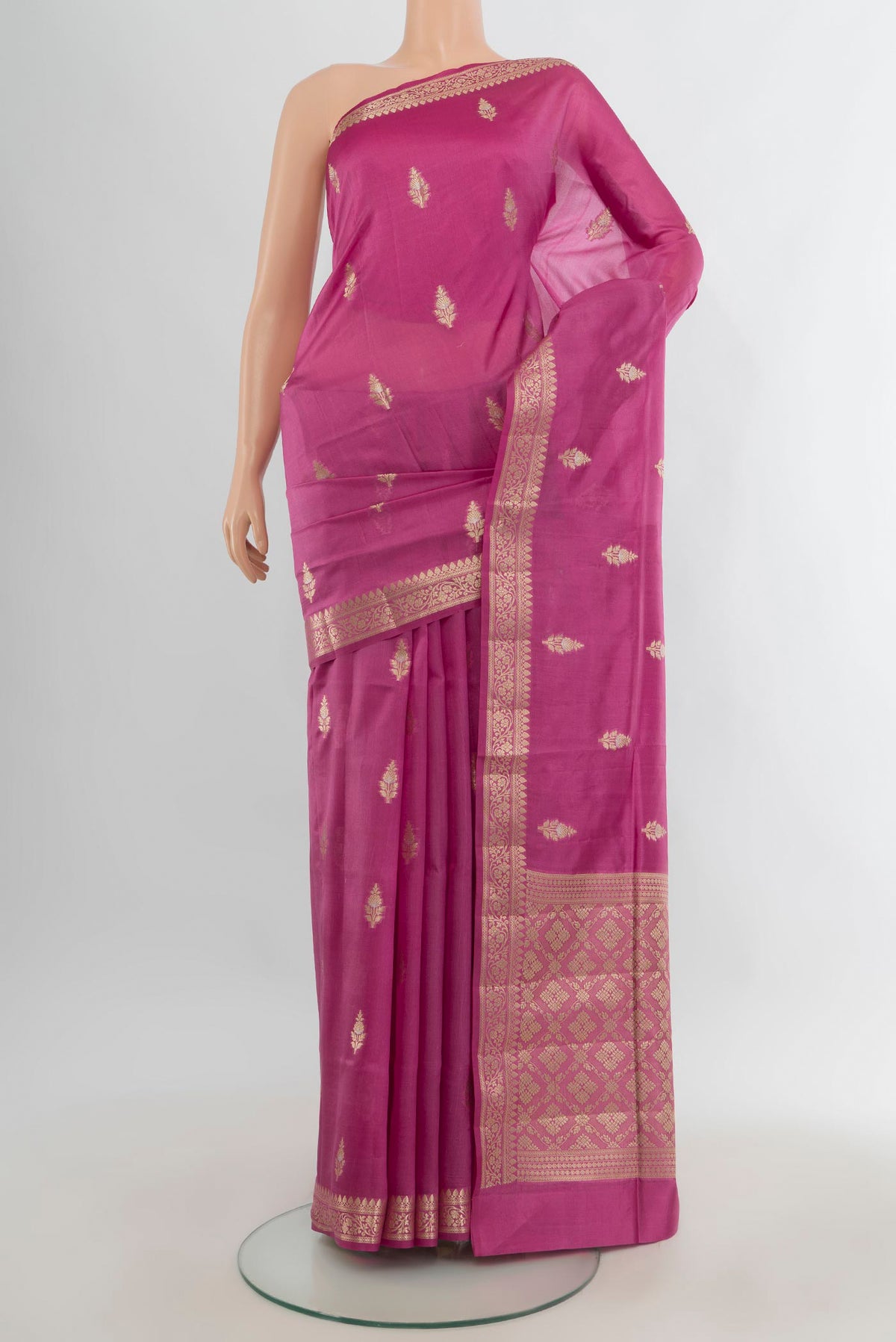 Pure Silk Pink Banarasi Raw Saree with Zari Butta on the body and Zari Border.  displayed on a mannequin