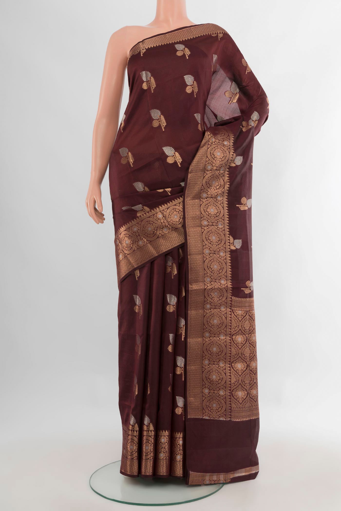 Pure Silk Coffee Brown Banarasi Raw Saree with Zari Butta on the body and Zari Border.  displayed on a mannequin