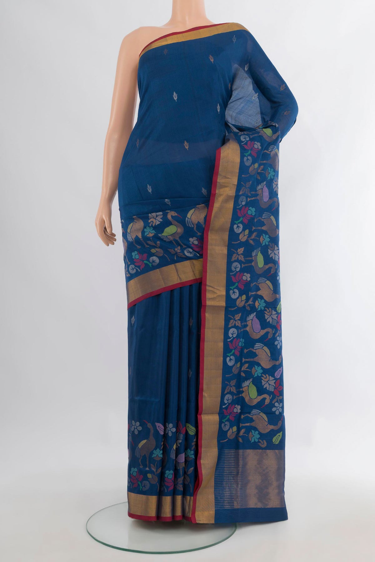 Pure Silk Peacock Blue Uppada Saree with Zari Butta on the body and Zari Border.  displayed on a mannequin