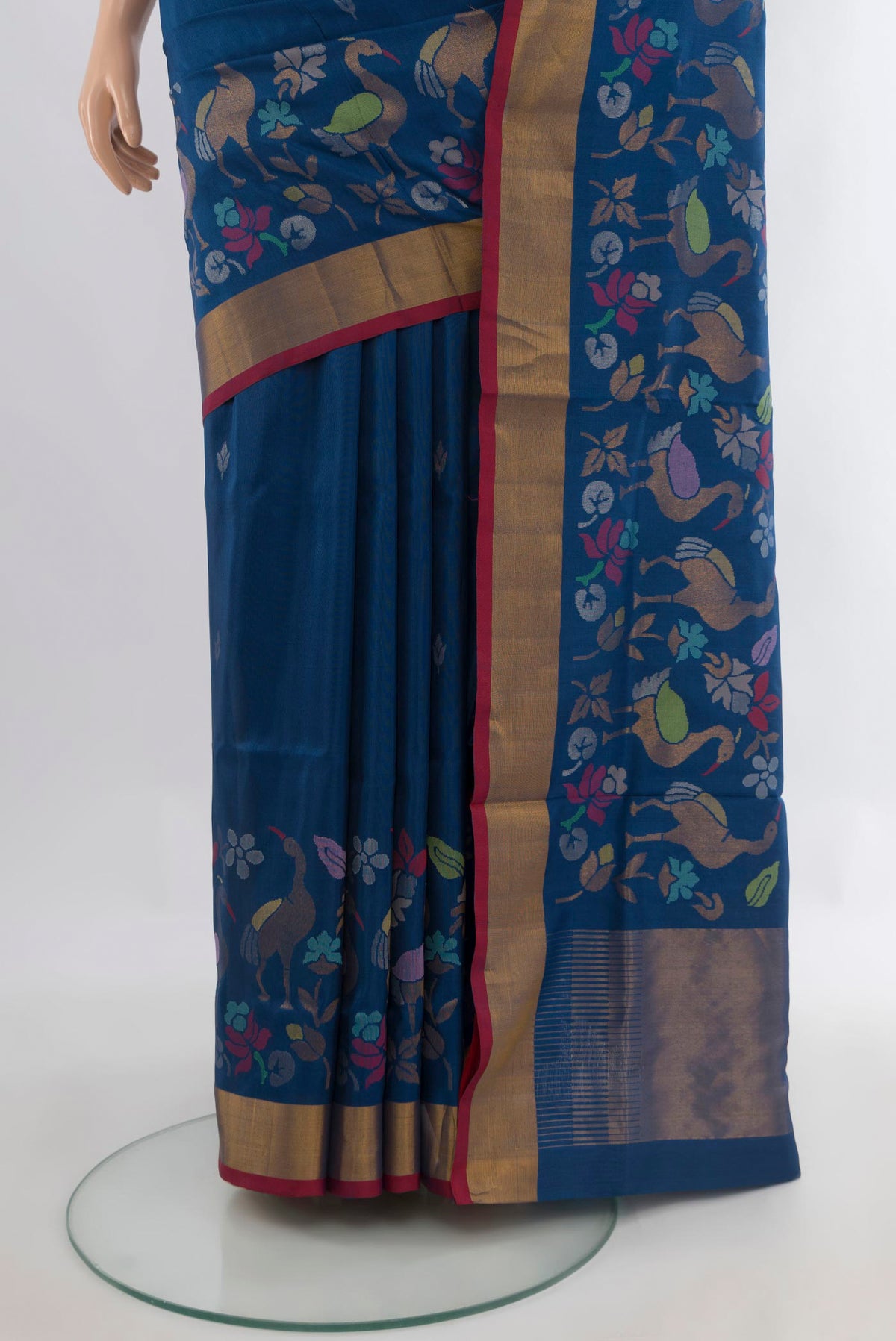 Pleats and pallu of Pure Silk Peacock Blue Uppada Saree with Zari Butta on the body and Zari Border. 