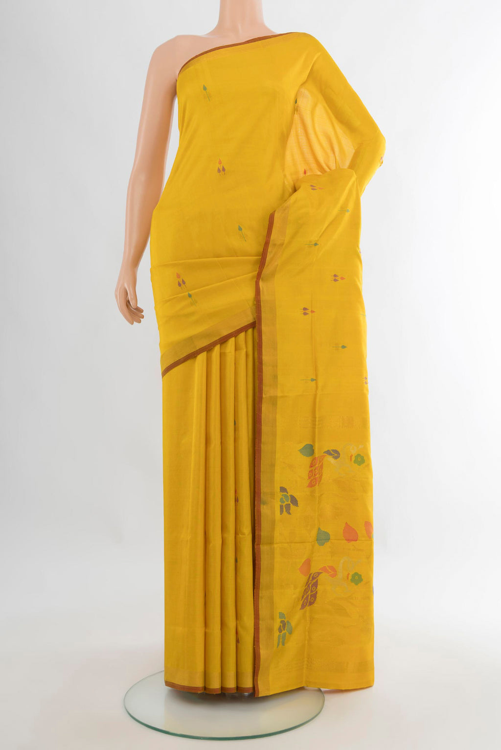 Pure Silk Yellow Uppada Saree with Zari And Thread Butta on the body and Zari Border.  displayed on a mannequin