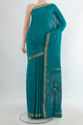 Pure Silk Peacock Blue Uppada Saree with Zari Butta on the body and Zari Border.  displayed on a mannequin