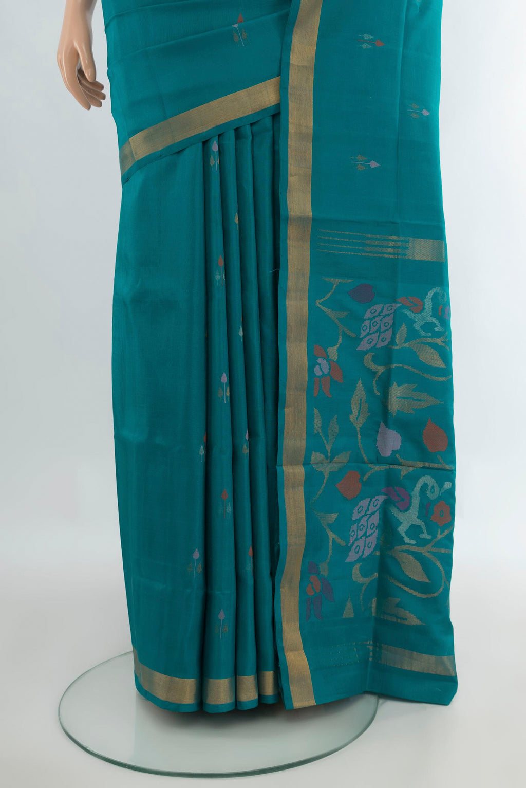 Pleats and pallu of Pure Silk Peacock Blue Uppada Saree with Zari Butta on the body and Zari Border. 