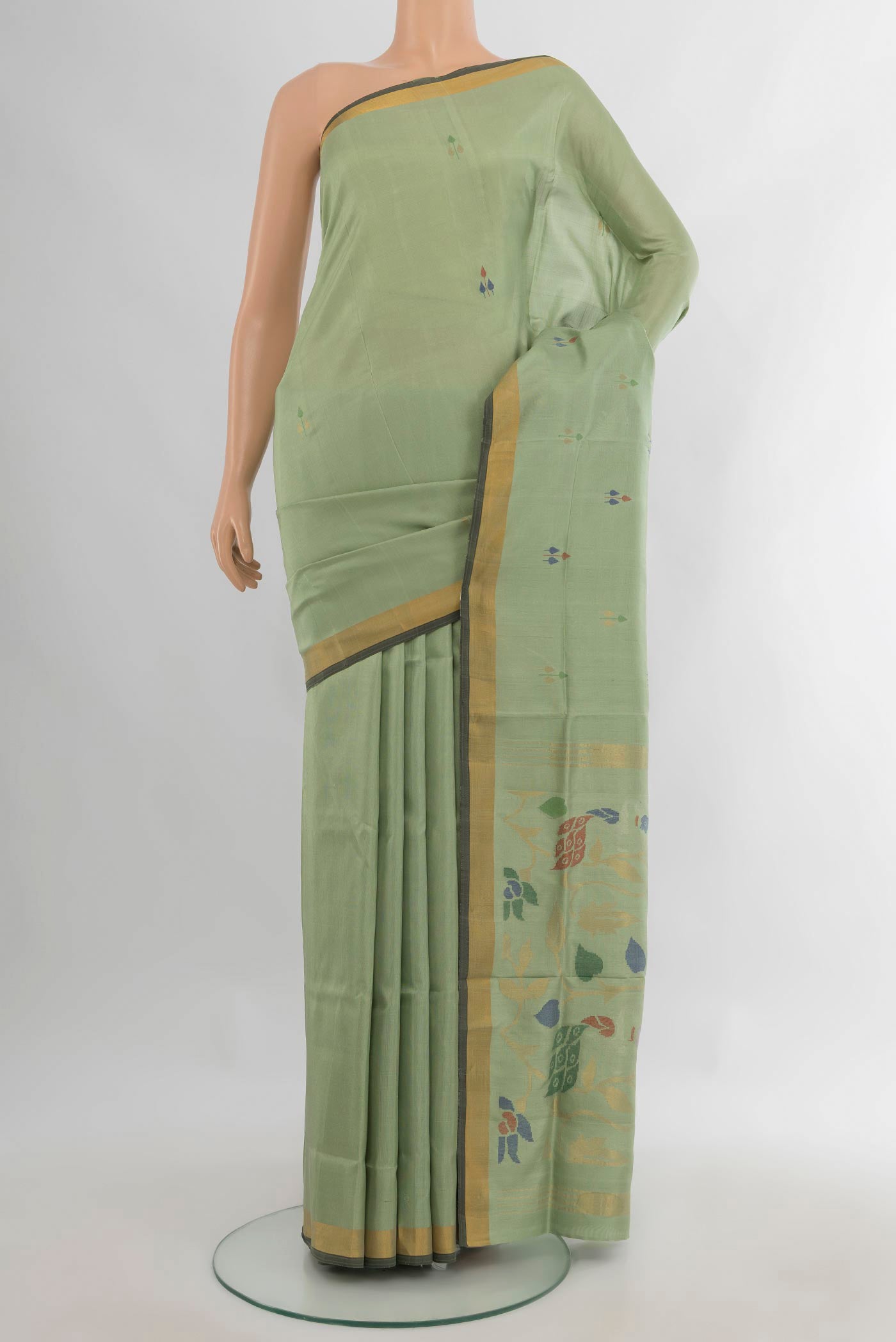 Pure Silk Light Green Uppada Saree with Zari And Thread Butta on the body and Zari Border.  displayed on a mannequin