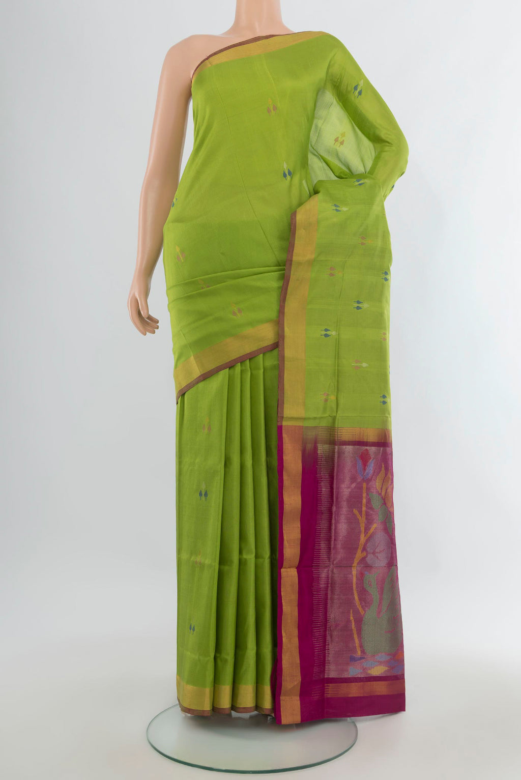 Pure Silk Light Green Uppada Saree with Zari And Thread Butta on the body and Zari Border.  displayed on a mannequin