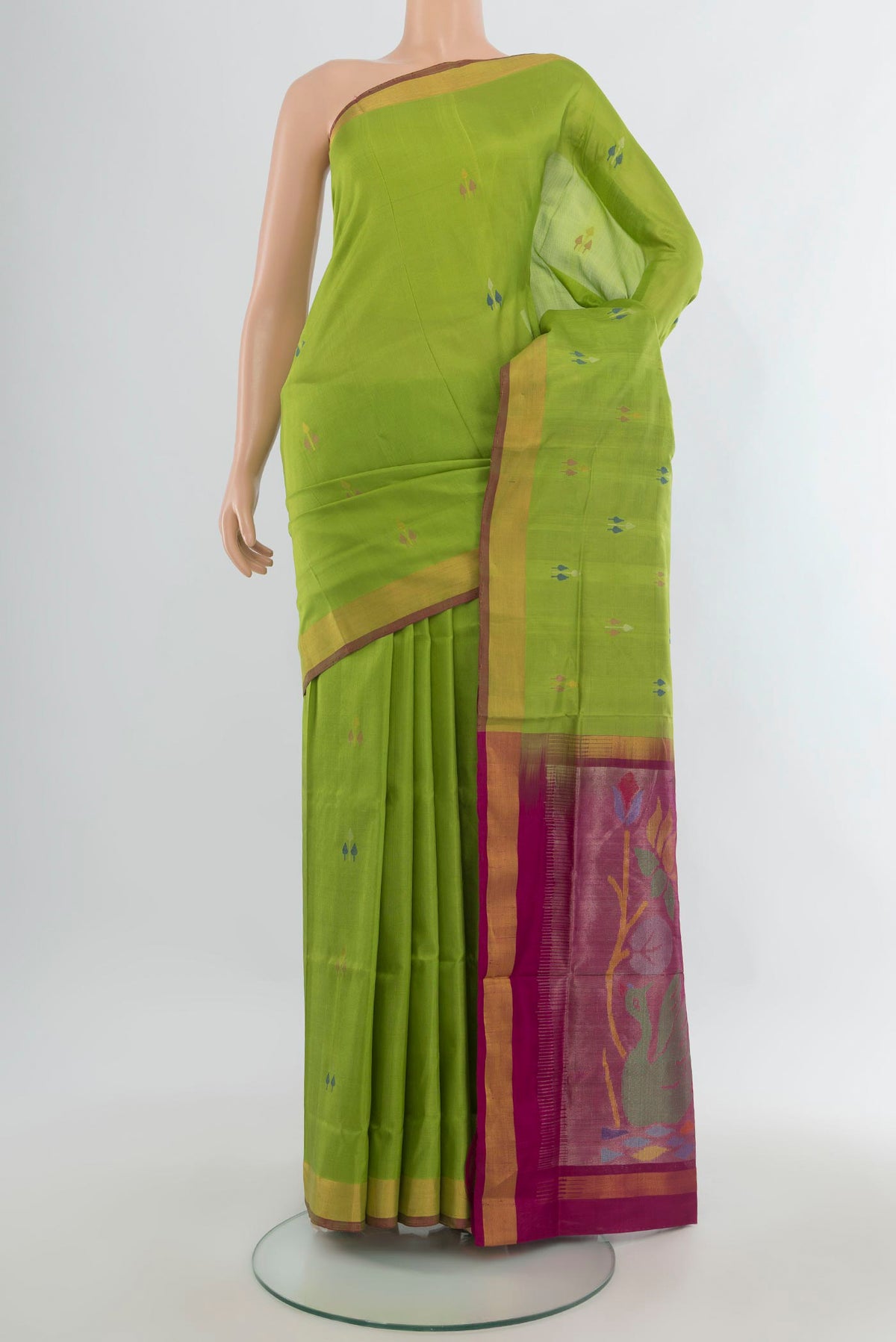 Pure Silk Light Green Uppada Saree with Zari And Thread Butta on the body and Zari Border.  displayed on a mannequin