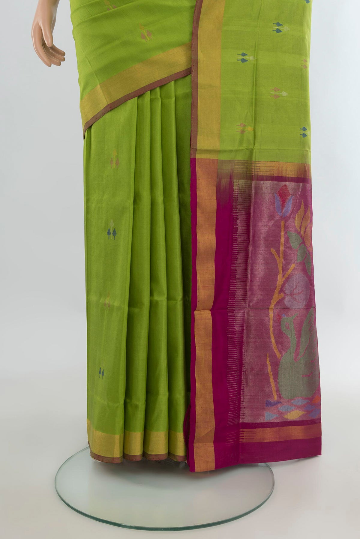 Pleats and pallu of Pure Silk Light Green Uppada Saree with Zari And Thread Butta on the body and Zari Border. 