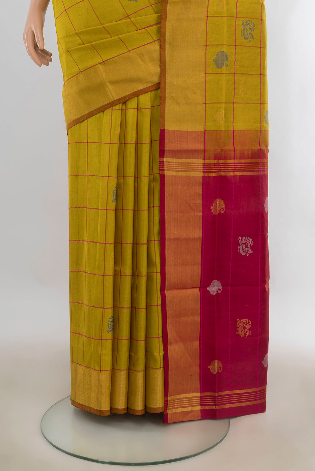 Pleats and pallu of Pure Silk Mustard Uppada Saree with Checked design on the body and Zari Border. 