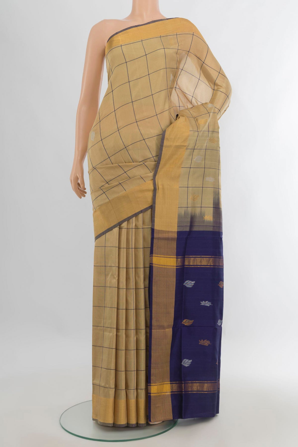 Pure Silk Beige Uppada Saree with Checked design on the body and Zari Border.  displayed on a mannequin