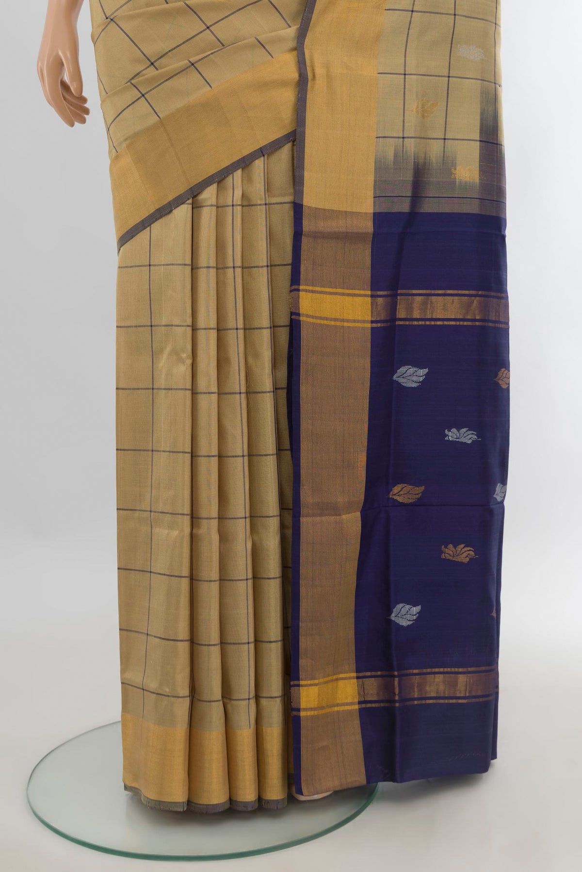 Pleats and pallu of Pure Silk Beige Uppada Saree with Checked design on the body and Zari Border. 