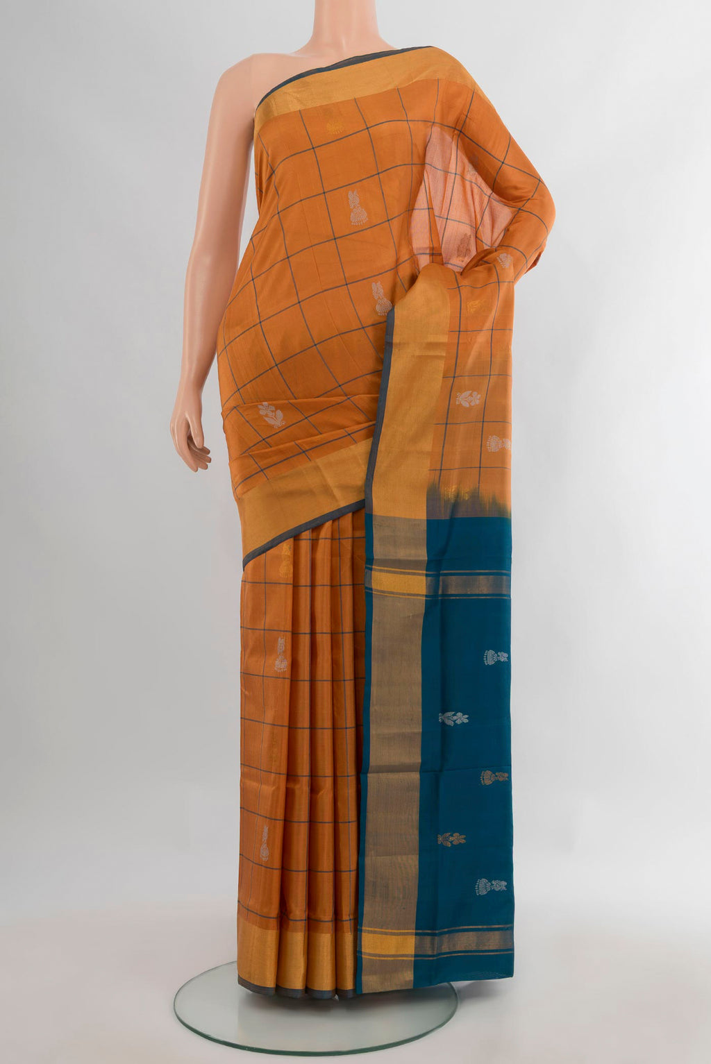Pure Silk Rust Uppada Saree with Checked design on the body and Zari Border.  displayed on a mannequin