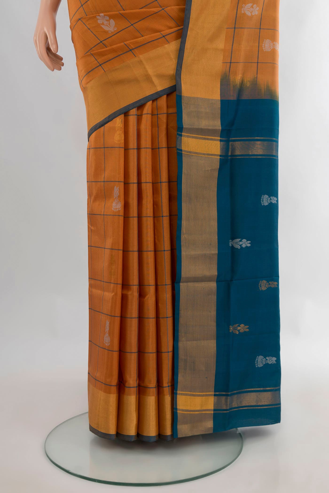 Pleats and pallu of Pure Silk Rust Uppada Saree with Checked design on the body and Zari Border. 